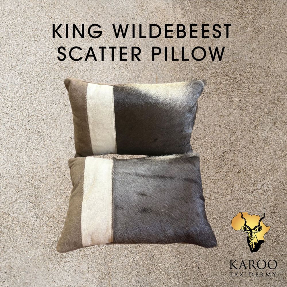 Two King Wildebeest hair-on-hide scatter pillows finished with contrasting leather panels