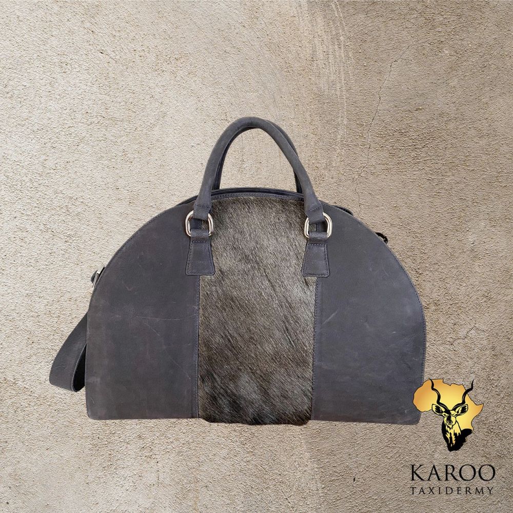 over_the_moon_carryon_travel_bag_with_blue_wildebeest_hide_insert_and_denim_timberland_leather.jpg