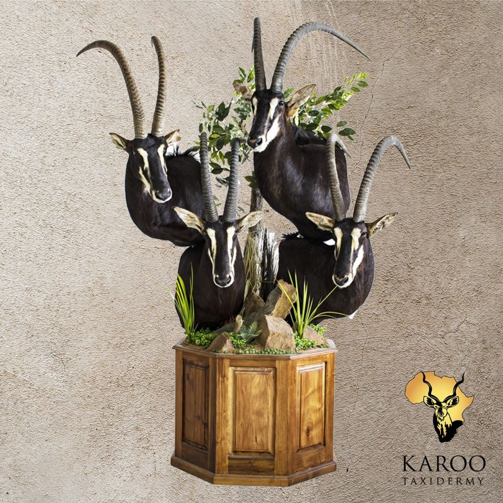Sable Pedestal Bouquet Mounted on a Hectagonal Floor Base with Rocekry and Vegetation