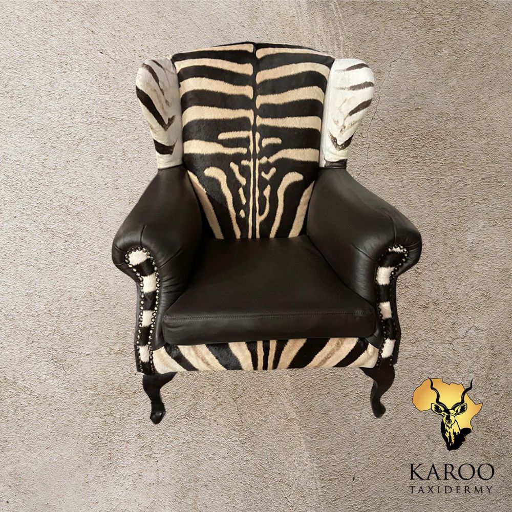 Burchell&rsquo;s Zebra Hide and Black Leather Wingback Chair &ndash; Full Zebra Back.